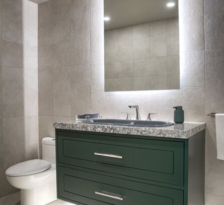the-vaults-lifestyle-storage-condo-bathroom-with-floating-green-sink-cabinet